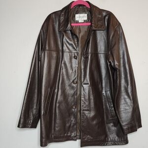 Juliano Celini brown leather jacket.  Button front.  Pockets.  Women's size XL.